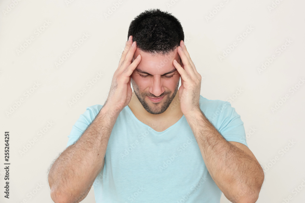 Young man with headache, portrait of worried young man Young man with headache, portrait of worried young man