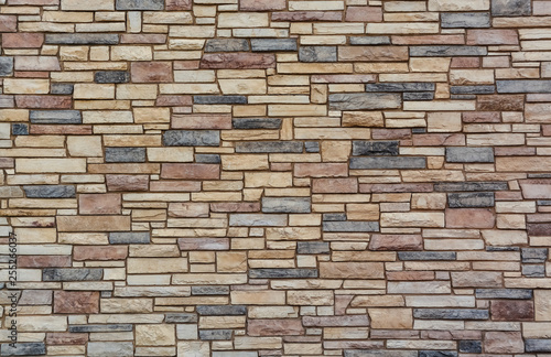 Brown colored stone setting. Cut stone wall texture