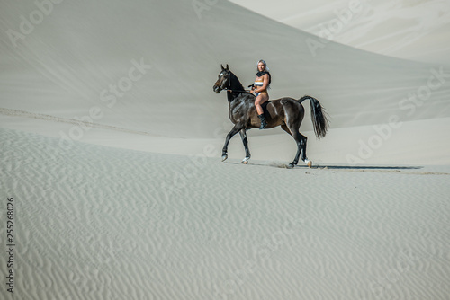 Desert Model and Her Horse photo