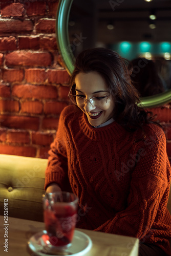 smiling brunette in a coffee shop