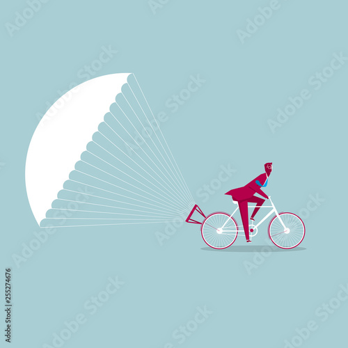 The bicycle is slowed down using a parachute. Isolated on blue background.