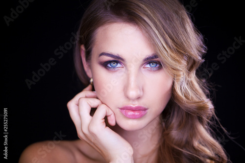 Closeup portrait of beautiful model with long blond hair