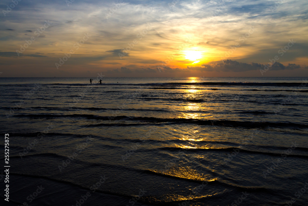Sunrise silhouette moring the beach
