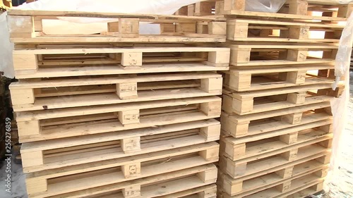Stacks of wooden Europallets ready for use photo