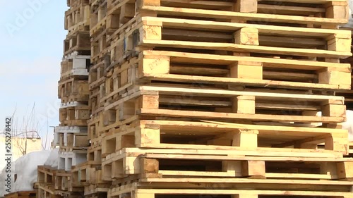 Stacks of wooden Europallets ready for use photo