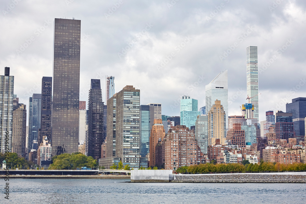 New York City skyline with skyscrapers next to the East River on a sunny day in October New York City skyline with skyscrapers next to the East River on a sunny day in October