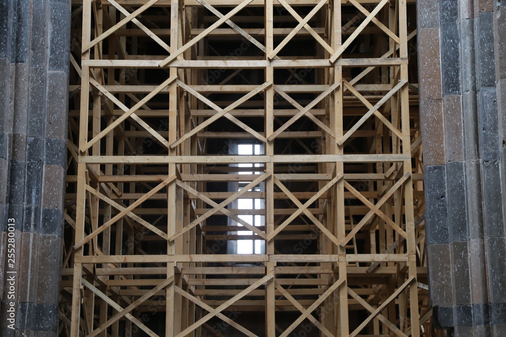 Restoration of old wooden churche against the gray sky. Kars Restoration of old wooden churche against the gray sky. Kars
