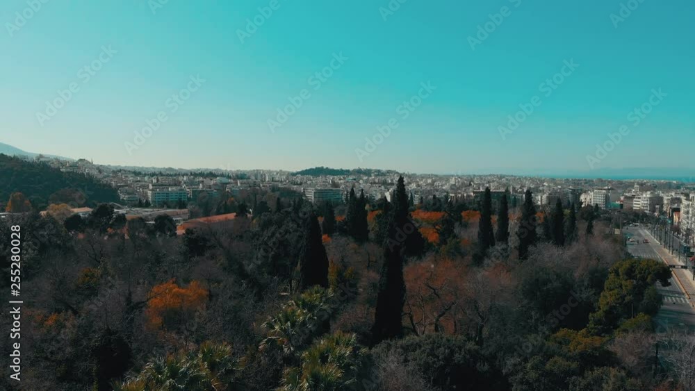 City views of day time with acropolis on a hill at the horizon, Athens, Greece
