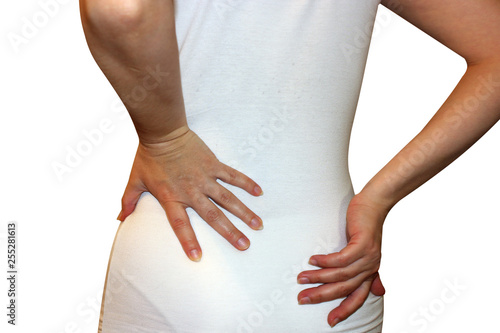 young woman pain at lower back, woman holding hand on lower back muscle area , isolated background