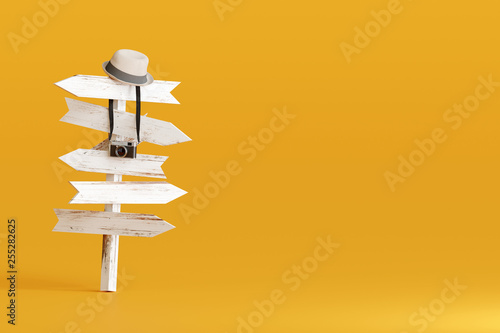Konstfotografi Hat and camera with signpost on yellow background