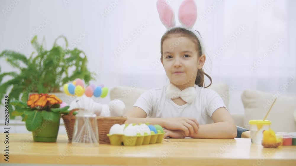 Littile girl is making shh gesture and lulls a soft bunny. Time to sleep. Littile girl is making shh gesture and lulls a soft bunny. Time to sleep.