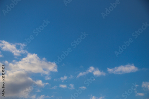 white fluffy clouds on  bright blue sky in Sunny weather