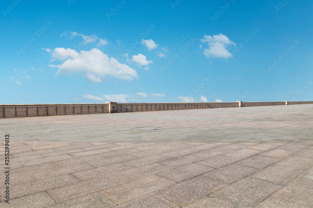 Empty square tiles and beautiful sky scenery Empty square tiles and beautiful sky scenery