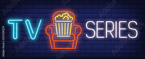 TV series neon text with popcorn bucket in armchair photo