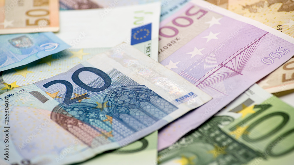 Euros bills of different values. Euro bill of twenty over others bills Euros bills of different values. Euro bill of twenty over others bills
