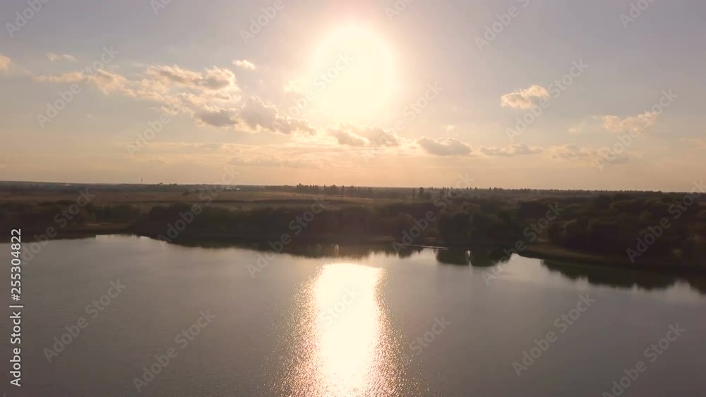 4K Aerial. Fly over evening sunset lake. Landscape, lateral flight. 4K Aerial. Fly over evening sunset lake. Landscape, lateral flight.