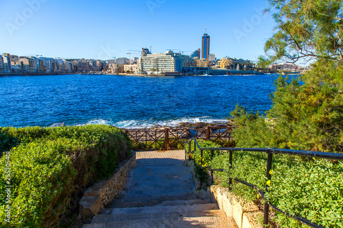 San Giljan, Malta, on January 7, 2019. View of the picturesque bay Spinola and beautiful embankment photo