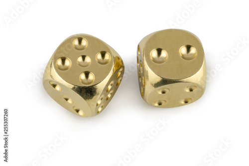 Two golden dices closeup isolated on white background. Five and two  with a shadow.