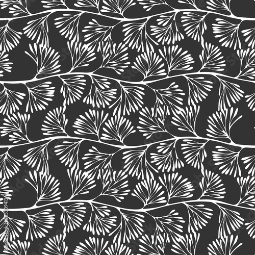 Abstract floral background. Seamless vector pattern. Whites silhouettes on black background.