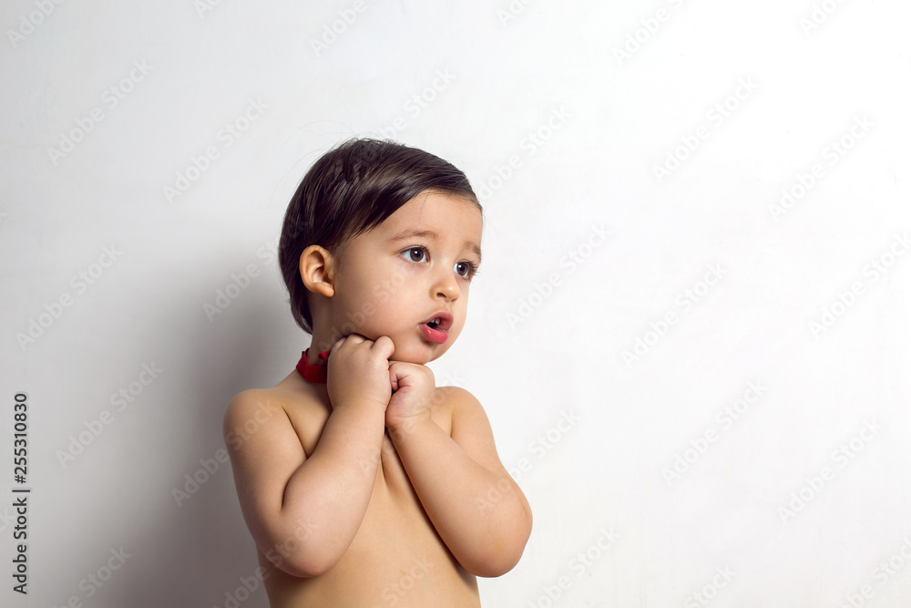 child without a t-shirt sitting on a white background child without a t-shirt sitting on a white background