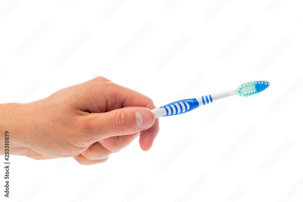 Obraz premium toothbrush in hand on an isolated background