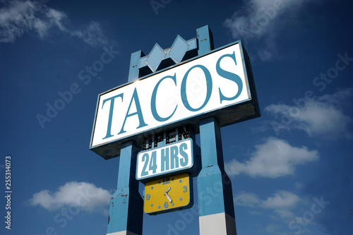aged and worn tacos sign 