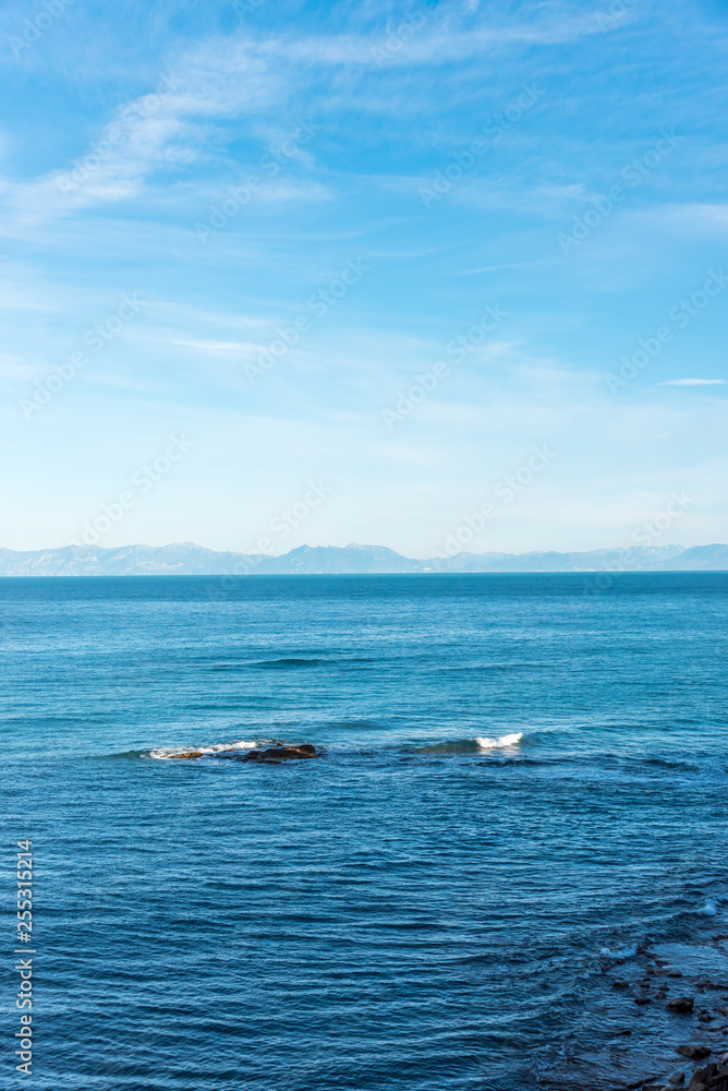 Obraz premium Blue Southern Italian Mediterranean Sea with Island in the Distance