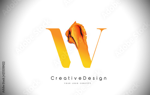 W Orange Letter Design Brush Paint Stroke. Gold Yellow w Letter Logo Icon with Artistic Paintbrush