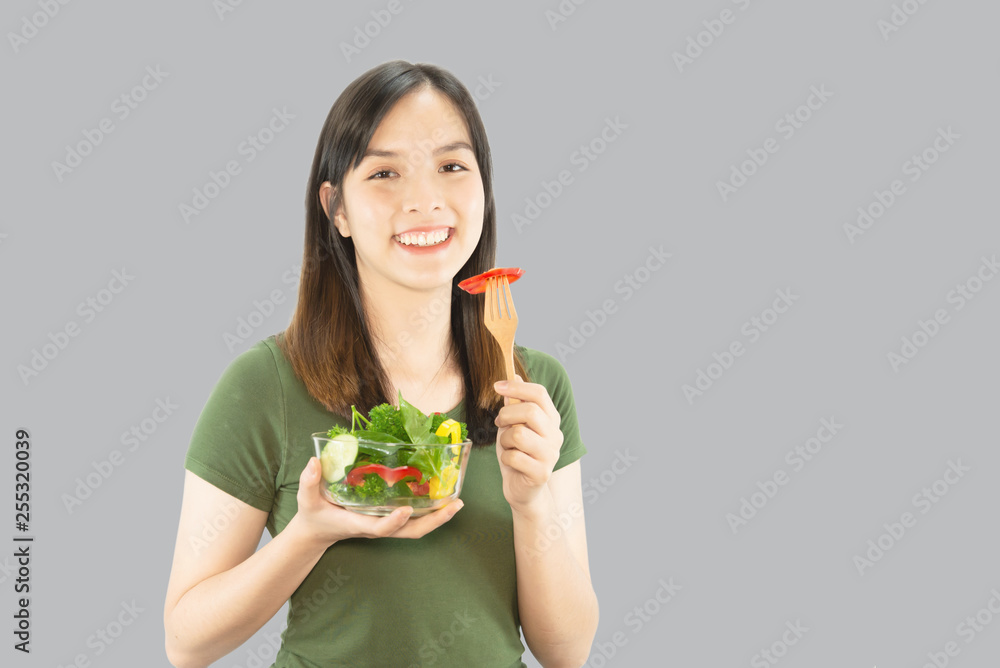 Happy lady holding kichen stuff over copy space background - people home made food preparation concept Happy lady holding kichen stuff over copy space background - people home made food preparation concept