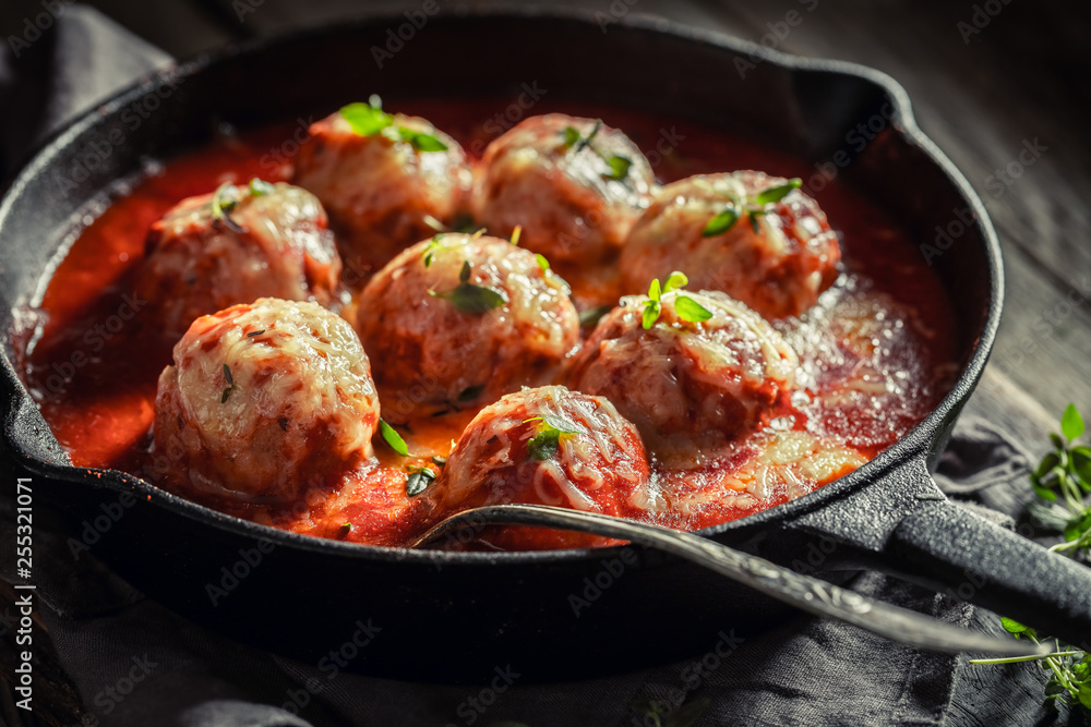 Tasty meatballs with tomato sauce and cheese Tasty meatballs with tomato sauce and cheese