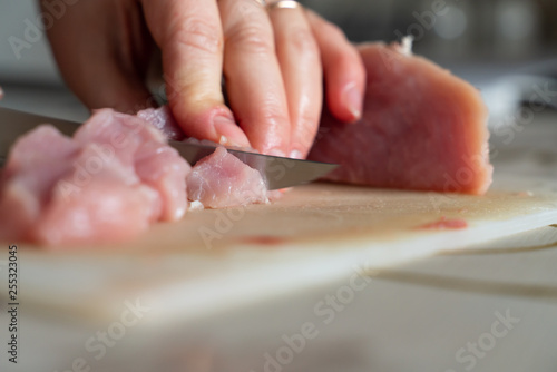 chopped meat food processing in the kitchen with knife