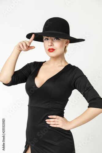 mysterious blonde wearing a hat