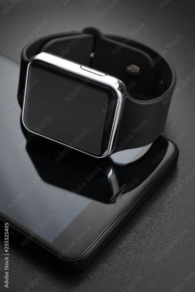 Black smart wrist watches and smartphone Black smart wrist watches and smartphone
