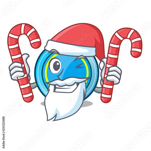 Santa with candy frisbee next a wooden cartoon table