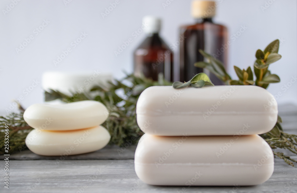 Cosmetic soap, cans of essential oil on a white background. Cosmetic soap, cans of essential oil on a white background.