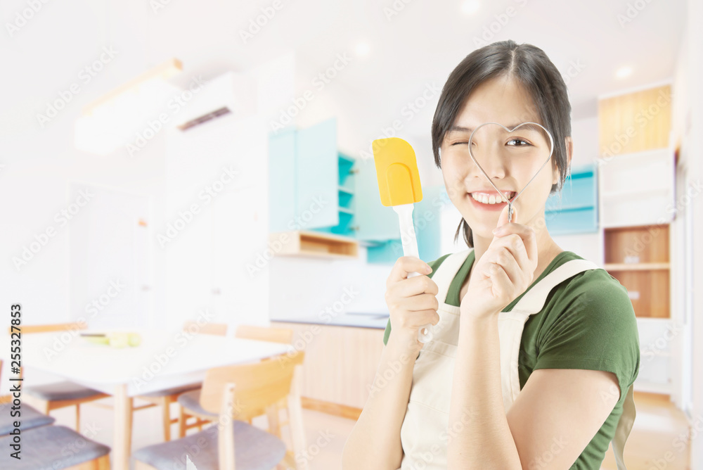 Happy lady holding kichen stuff over copy space background - people home made food preparation concept Happy lady holding kichen stuff over copy space background - people home made food preparation concept
