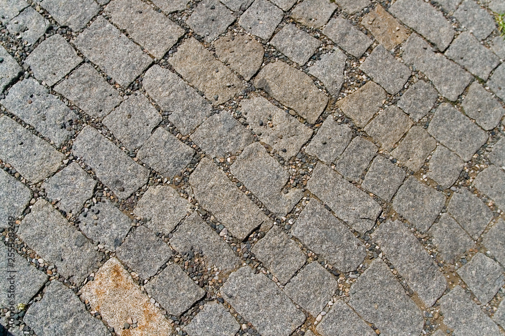 Textured beautiful stone pavement photographed close-up. Textured beautiful stone pavement photographed close-up.