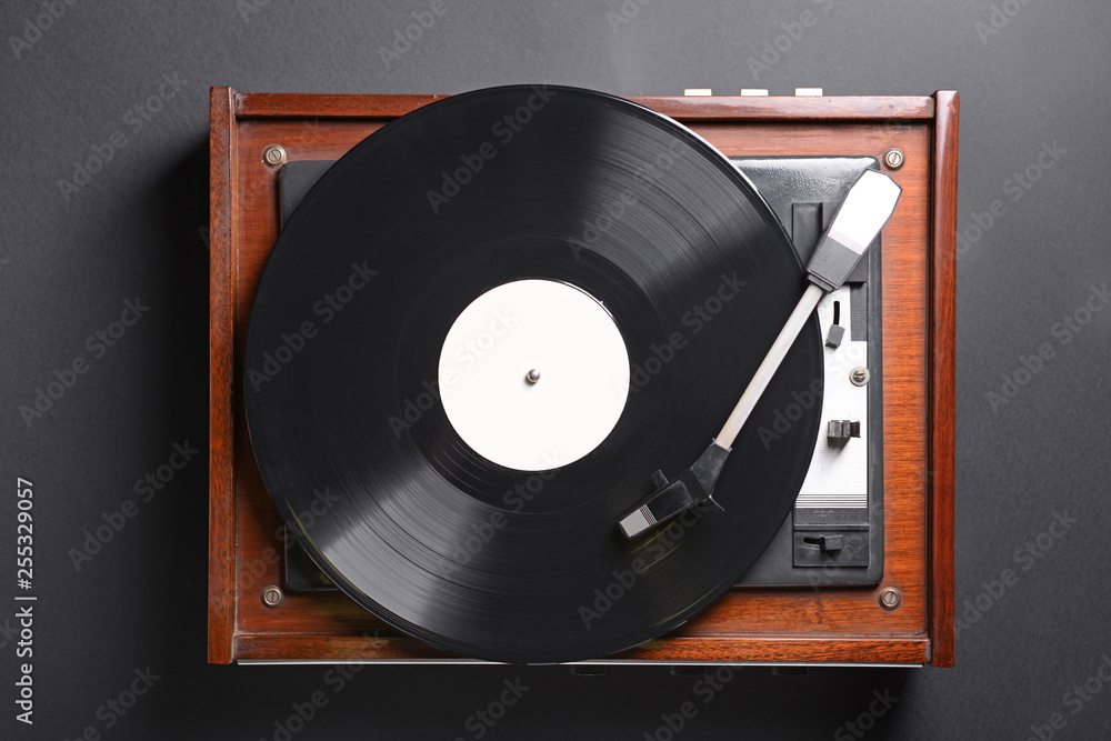 Obraz premium Record player with vinyl disc on dark background