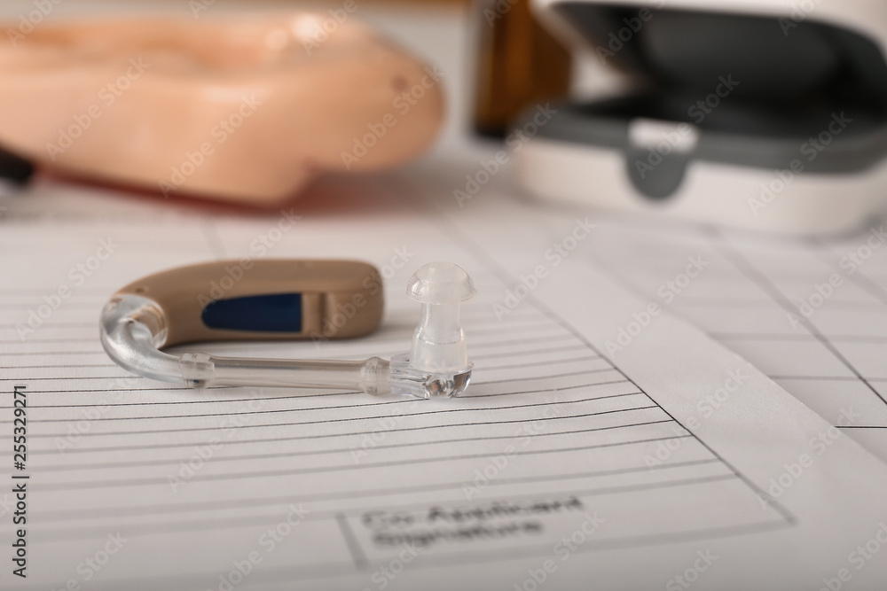 Hearing aid on table of doctor Hearing aid on table of doctor