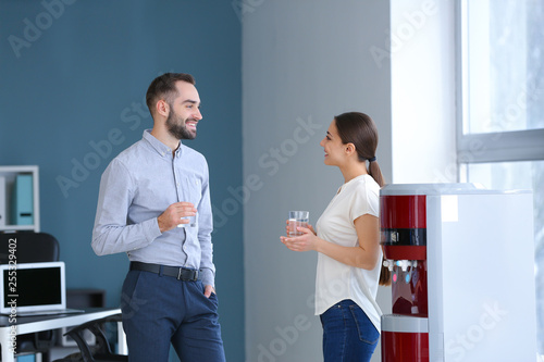 Colleagues drinking water f...