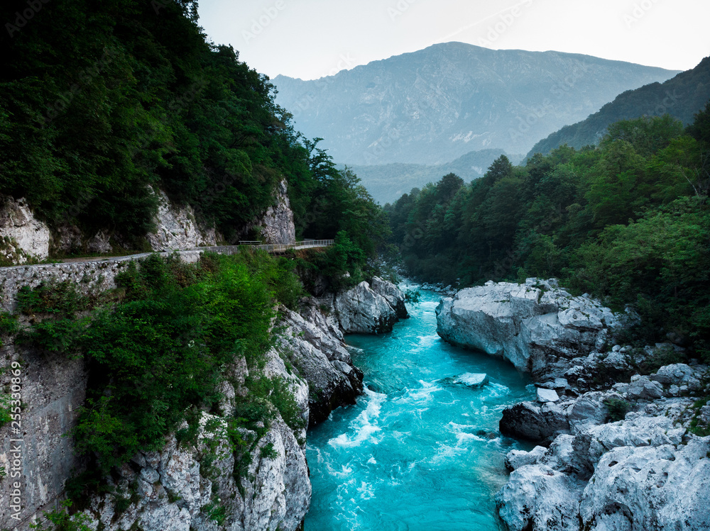 Dramatic Soca river flows in rocky mountains