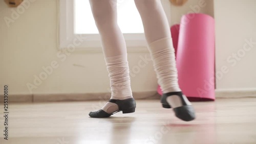  image of close-up feet of ballerina practicing