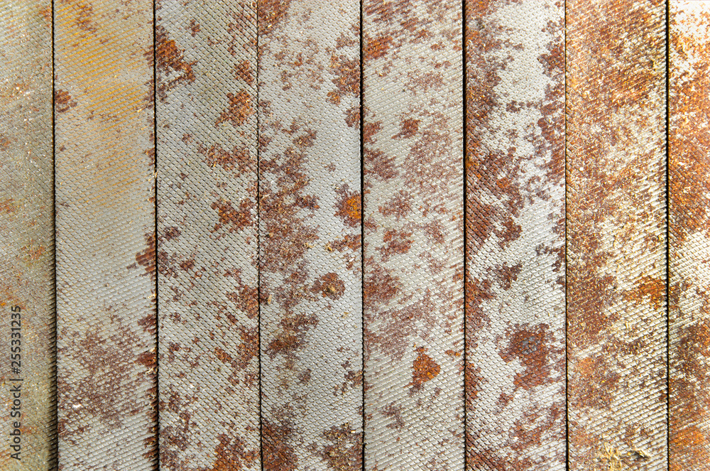 rusty metal background from needle files. save space. vertical line. set of tools rusty metal background from needle files. save space. vertical line. set of tools
