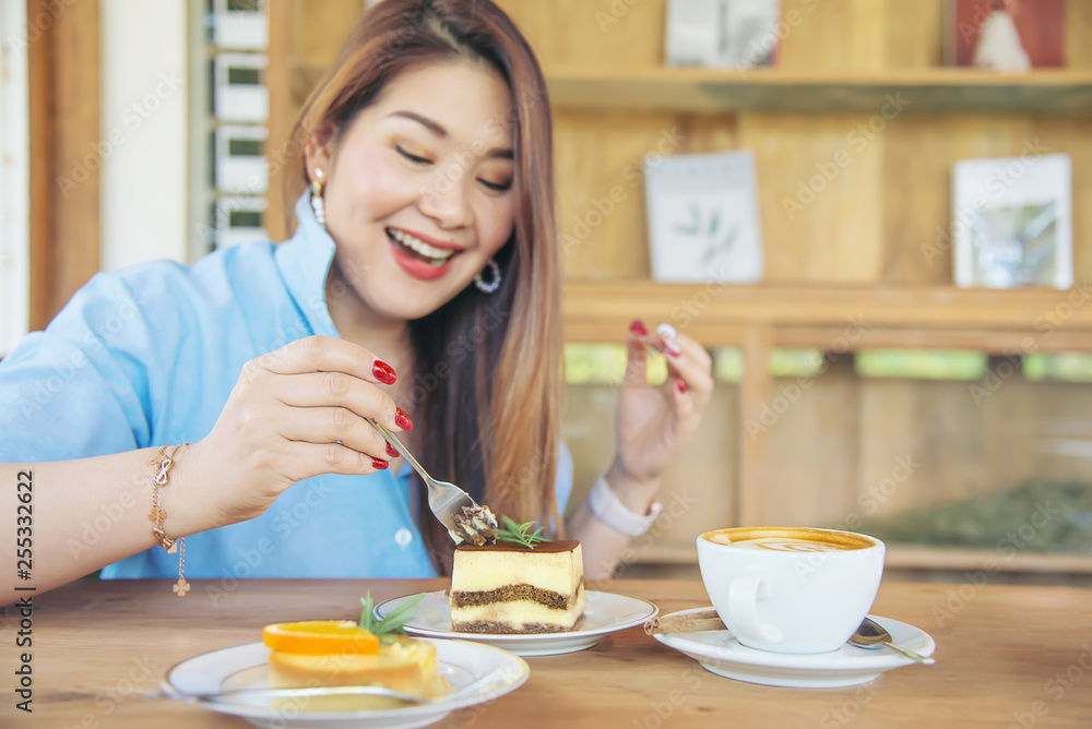 Portrait happy young Asian lady in coffee shop - woman in relax time concept Portrait happy young Asian lady in coffee shop - woman in relax time concept