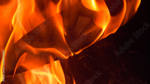 MACRO DOF: Cinematic shot of a flaming blade being lifted out of the hot oil. photo