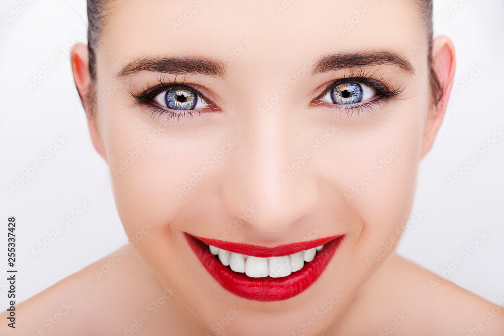 Beautiful young model with red lips and white teeth. Gorgeous Woman Face. Beautiful young model with red lips and white teeth. Gorgeous Woman Face.