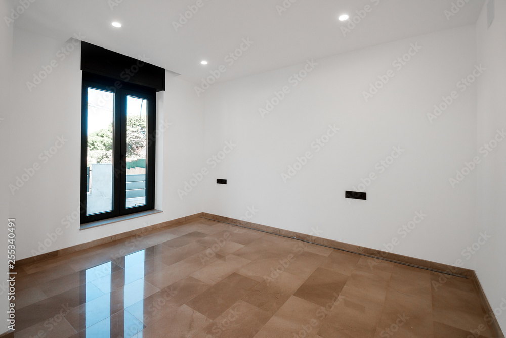 Fototapeta premium Empty rooms in a new house with large windows overlooking the sea. Automatic blinds. Glass partition terrace.