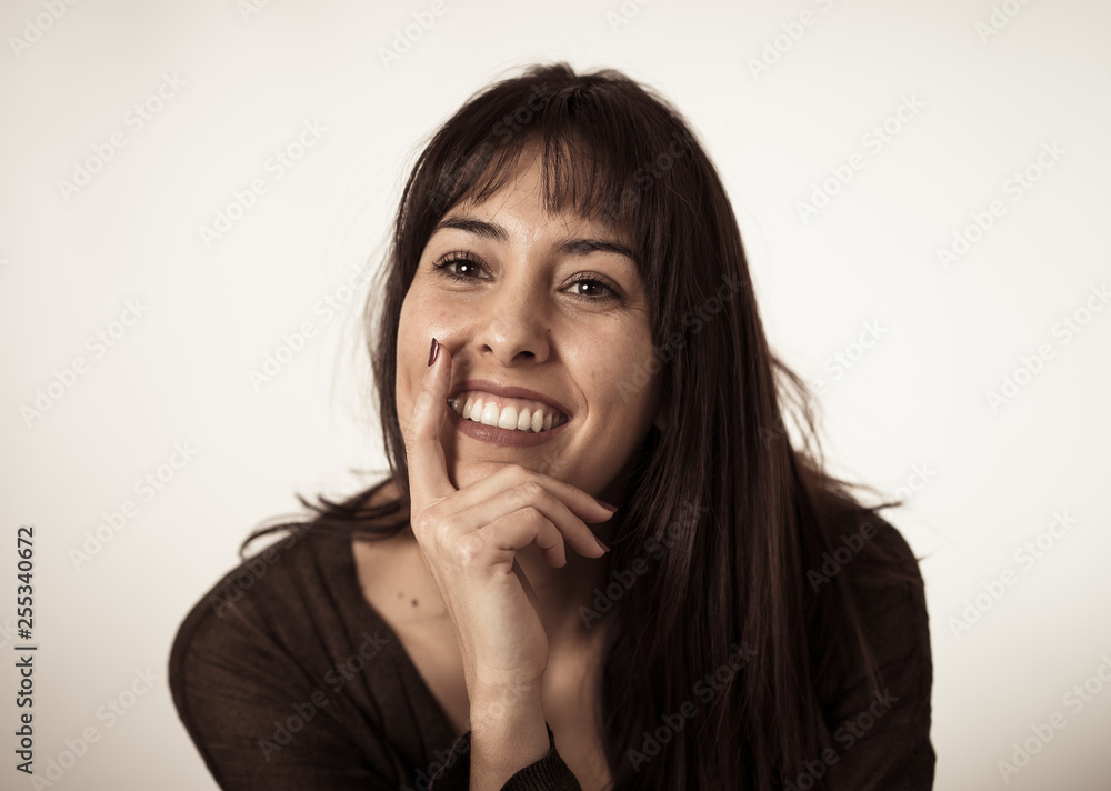 Portrait of young attractive woman with happy and smiling face. Human expressions and emotions Portrait of young attractive woman with happy and smiling face. Human expressions and emotions