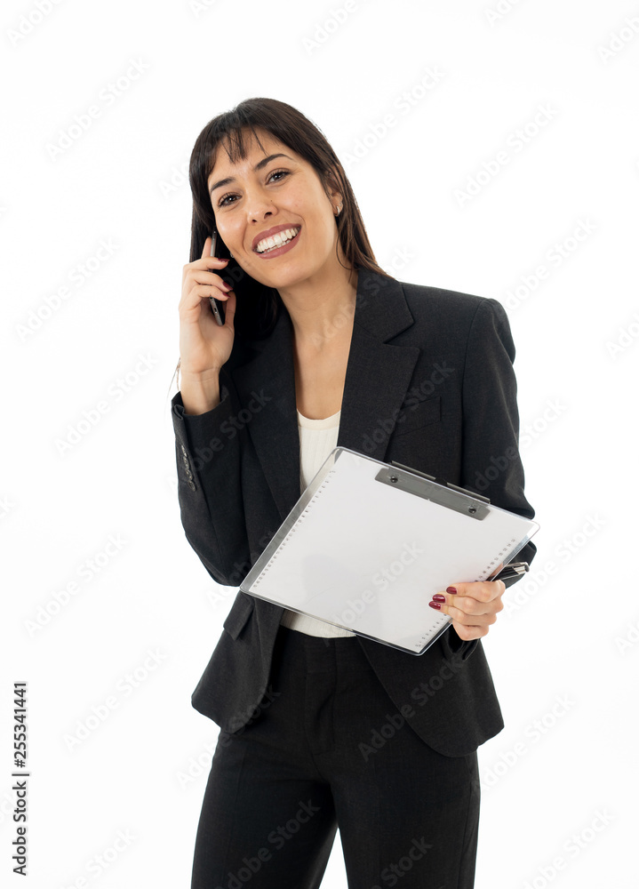 Successful young business woman talking on phone holding a folder. Isolated on white background. Successful young business woman talking on phone holding a folder. Isolated on white background.