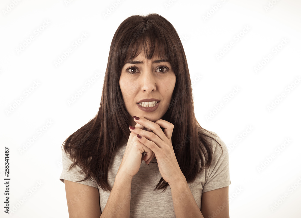 Portrait of a young attractive woman looking scared and shocked.Human expressions and emotions Portrait of a young attractive woman looking scared and shocked.Human expressions and emotions